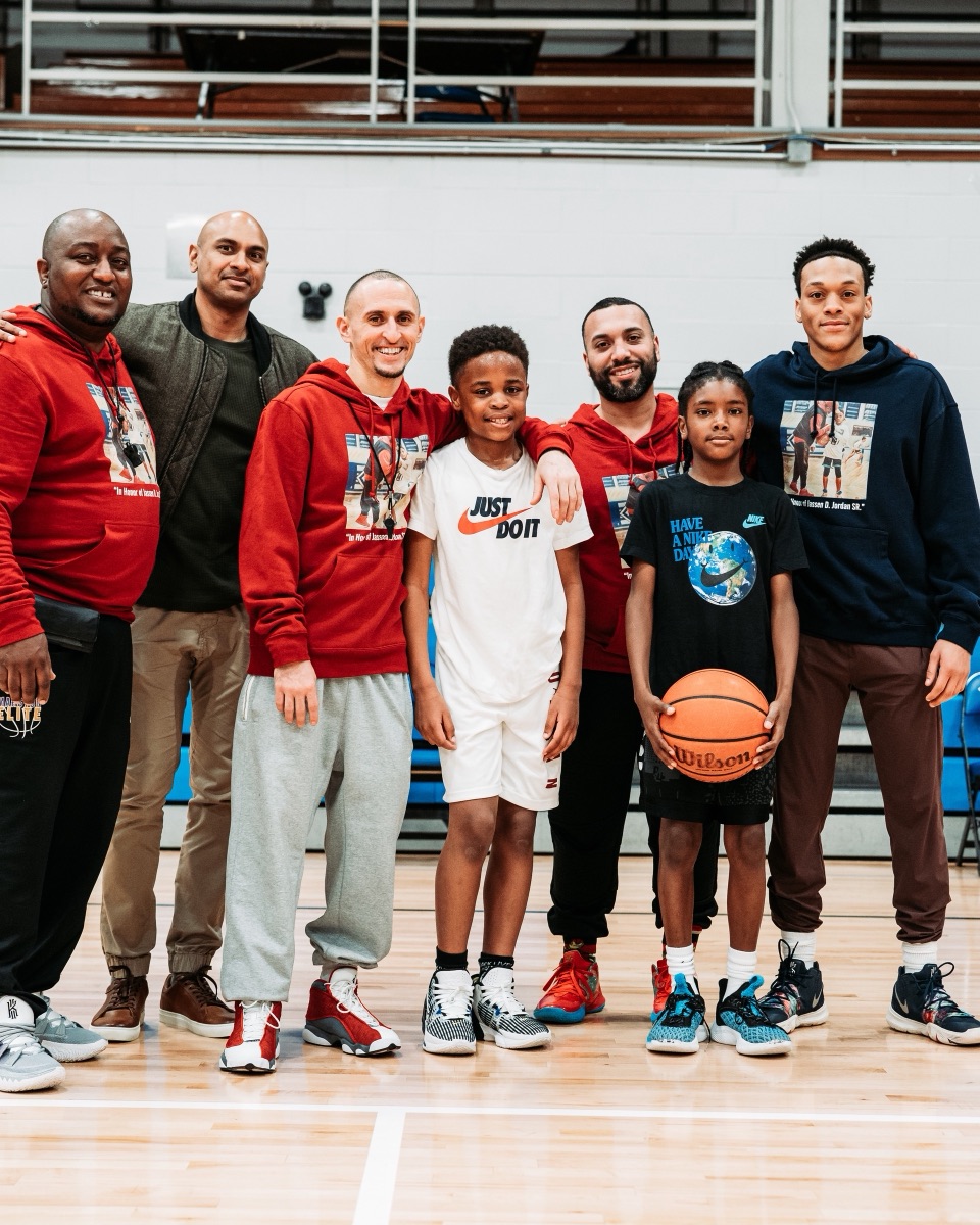 Marston Athletics coaching staff with players on the court