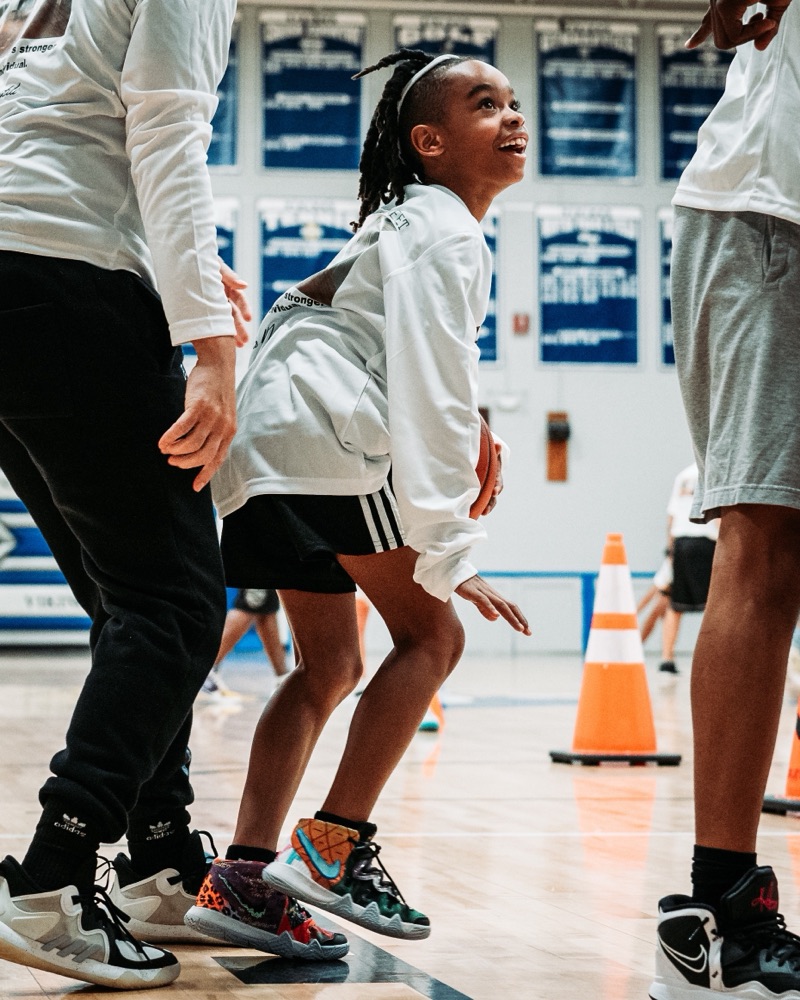 A young player in a defensive stance during a Marston Athletics workout