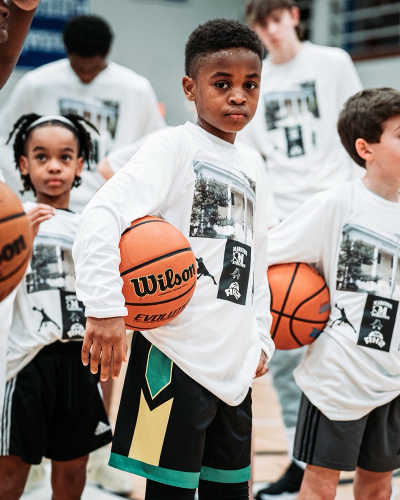 Young Marston Athletics player holding a basketball